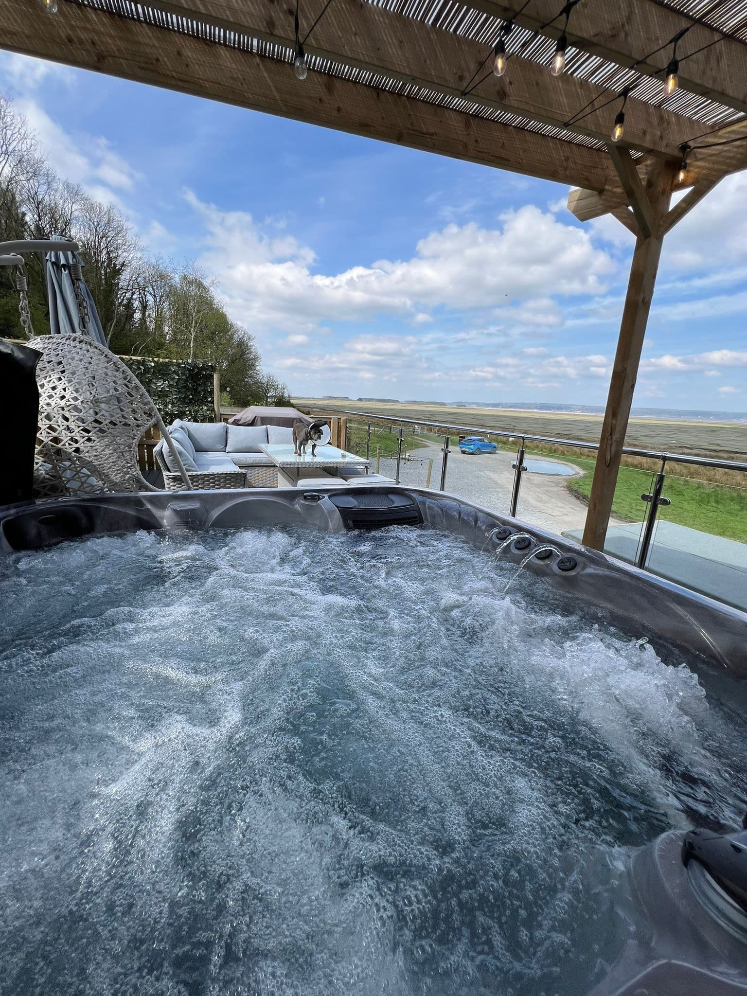 Cabin terrace with a private hot tub